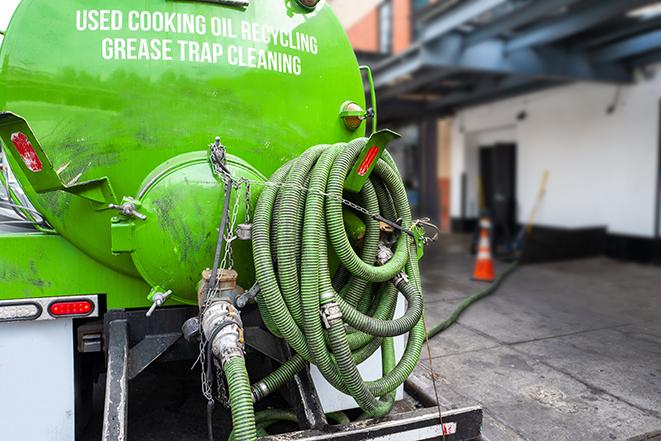 a vacuum truck pumping out a large underground grease trap in Commercial Point OH